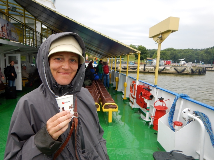 Of course I am smiling on the ferry to Klaipeda; he gave me the raincoat and the coffee!